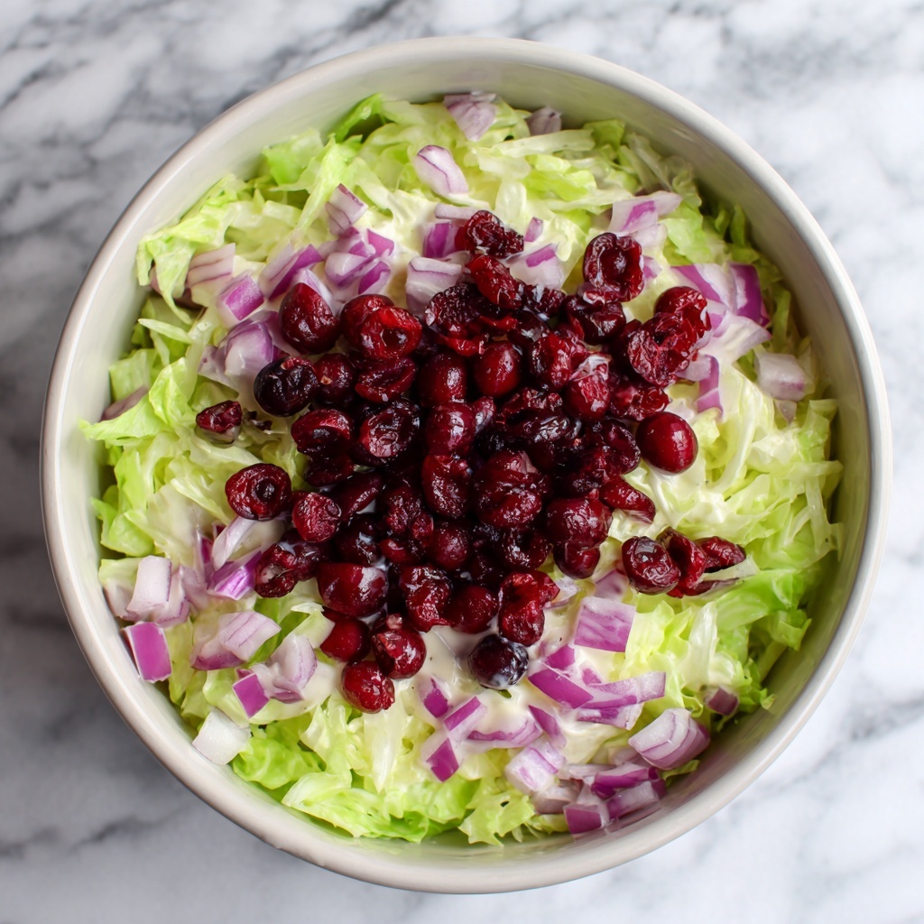 Creamy Brussels Sprouts Slaw with Cranberries, Parmesan, and Orange-Honey Dressing Recipe - Recipe Image